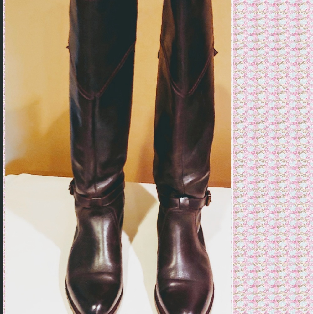 Knee  high Frye riding boots.